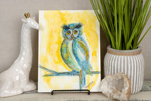 Alcohol ink painting of bright sunny wise owl perched on tree limb