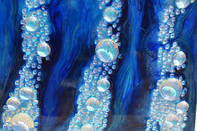 underwater blue ocean art with glass bubbles close up