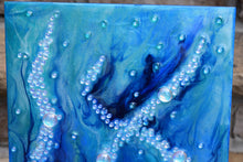 underwater blue ocean art with glass bubbles close up
