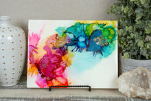 abstract splashes of rainbow colored alcohol ink