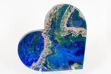 abstract blue green heart with stones