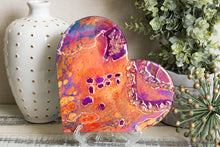 abstract orange purple heart with stones