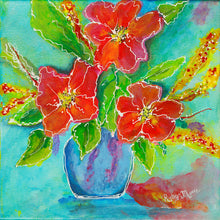 Bright red and orange flowers in a blue vase