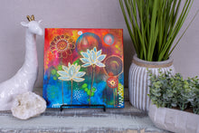 colorful abstract acrylic and ink lotus painting with under layers peeking through the organic shapes and texture elements